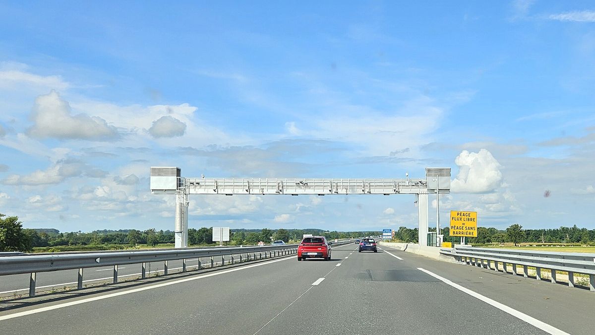 A free-flow tolling gantry spanning a motorway in France
